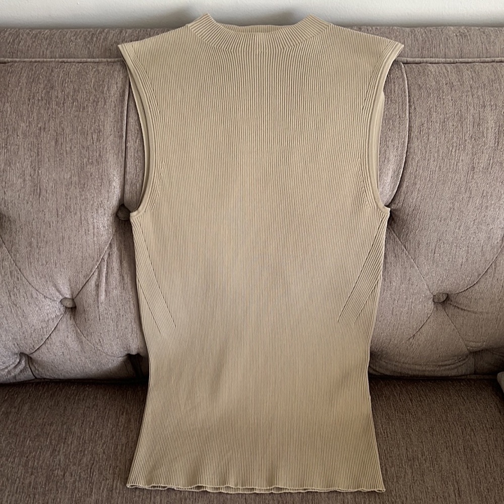 Hugo Boss sleeveless tops, fantastic quality. Very beautiful fit.Practically new